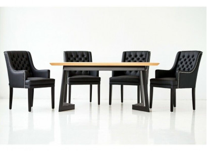 Designer dining table with 4 Chesterfield chairs seating group.